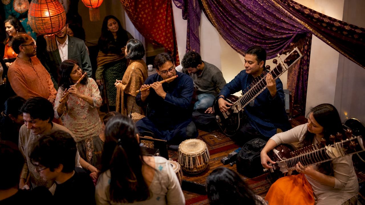 Diverse group performing traditional music outdoors