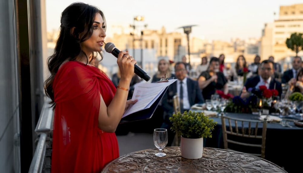 Wedding emcee speaking to reception guests